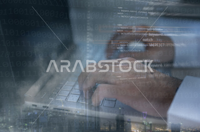 A young Saudi Gulf working as a web developer, using programming languages, developing and building websites and electronic applications, codes and algorithms, and computer technologies