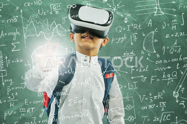 A Saudi Arabian Gulf student wearing school uniform and school bag using virtual reality glasses in front of a set of mathematical and scientific operations using the 3D hologram feature, Education in the Kingdom of Saudi Arabia