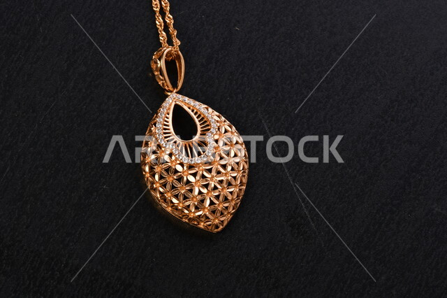 Image of a gold necklace on a black background, gold chain around the neck, jewelry store, yellow precious gold, precious jewelry, shiny decorative gold chain
