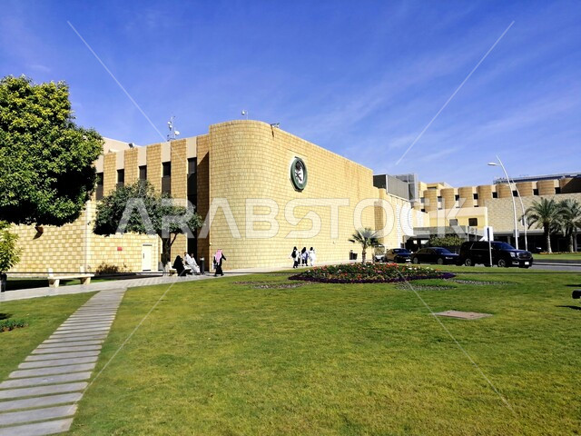Urban development and progress, service and patient care centers in Saudi Arabia, the medical support services building of King Faisal Specialist Hospital and Research Center in Riyadh, trees, lawns and green plants around hospitals