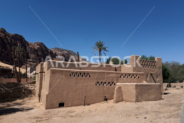 Authentic Arab heritage and civilization, tourist villages in Saudi Arabia, old-style architectural art of traditional heritage mud houses and homes in the old town of Al-Ula during the day, highlands and rock formations