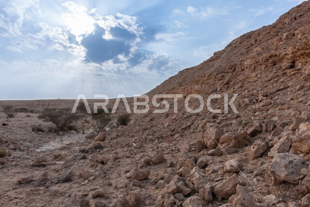 Natural sedimentary mountains, rock formations and formations, famous ancient historical archaeological sites in the Kingdom of Saudi Arabia, wild plants in the desert nature, terrain and rock carvings in Wadi Nar Abu Jafan Euphrates