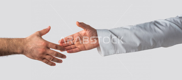 Hand portrait of a Saudi Arabian Gulf man shaking hands with another man, acquaintance, work agreement, new deal, white background