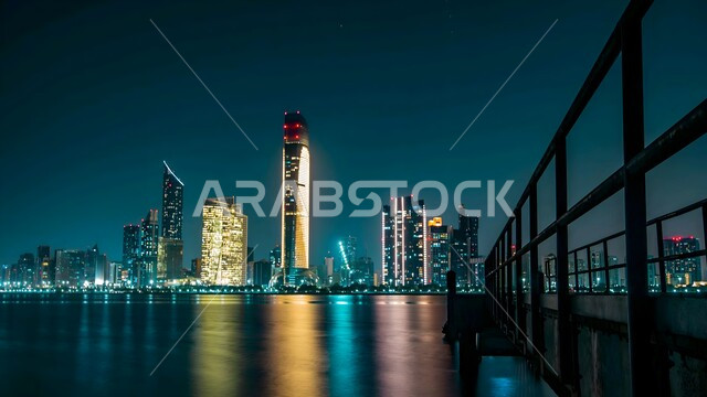 الفن الهندسي المعماري للأبراج وناطحات السحاب المضيئة ليلا في مدينة ابو ظبي, معالم وأماكن سياحية مشهورة, المباني والمنشآت السكنية والتجارية في الامارات العربية المتحدة، جذب واستقطاب السياح من أنحاء العالم، النمو والتطور العمراني على ساحل الخليج