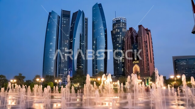 ناطحات السحاب والأبراج العالية المضيئة ليلا في مدينة ابو ظبي, معالم وأماكن سياحية مشهورة, المباني والمنشآت السكنية والتجارية في الامارات العربية المتحدة، جذب واستقطاب السياح من أنحاء العالم، النمو والتطور العمراني على ساحل الخليج