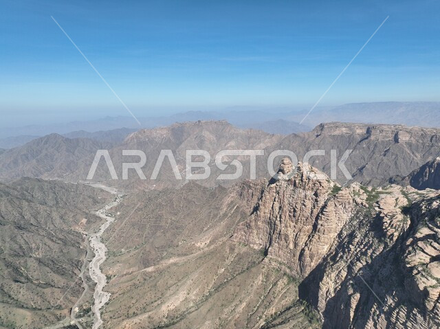 Mountain ranges and heights, rock formations and formations in Jazan city, green plants planted on Al-Qahr Mountains, distinctive natural landscapes, famous tourist places and landmarks in the Kingdom of Saudi Arabia