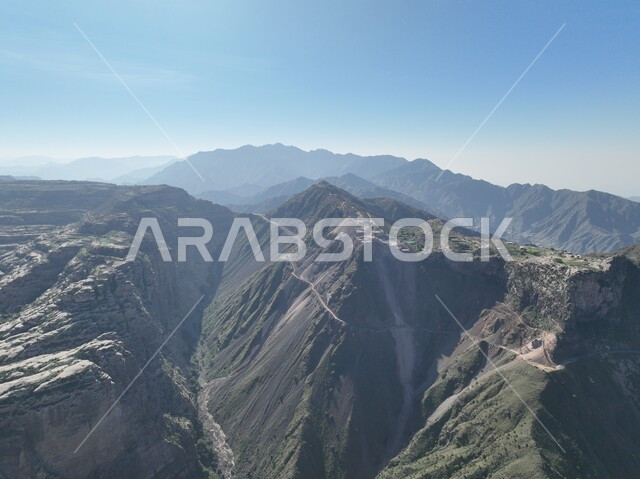Highlands and mountain ranges, rock formations and formations in Jazan city, green plants planted on Al-Qahr Mountains, distinctive natural landscapes, famous tourist places and landmarks in the Kingdom of Saudi Arabia