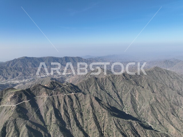 Rock formations and formations in Jazan city, highlands and mountain ranges, green plants planted on the Qahar Mountains, distinctive natural landscapes, famous tourist places and landmarks in the Kingdom of Saudi Arabia