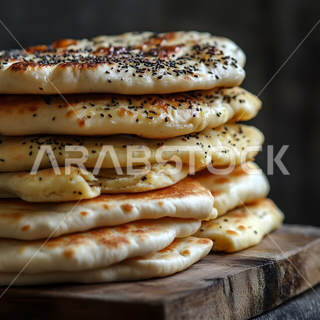 أرغفة الخبز العربي التقليدي، الخبز المفرود والمرقوق في الافران العربية الشعبية, إعداد المعجنات والمخبوزات الشهية في المخابز في المملكة العربية السعودية، خبز ساخن طازج، منتجات وطنية محلية