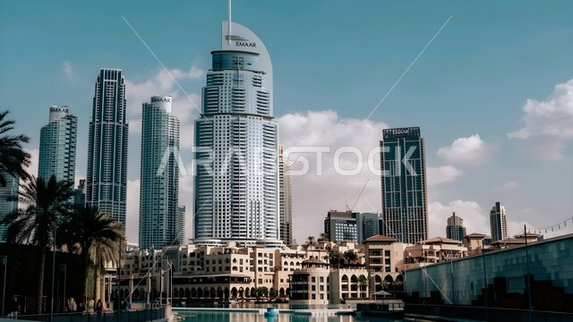 Development and urban growth of buildings and commercial facilities, attracting and attracting tourists from all over the world, The Address Hotel in the Emirate of Dubai in the United Arab Emirates, architectural engineering of towers and skyscrapers, famous tourist landmarks and places, Downtown Dubai Mall Towers