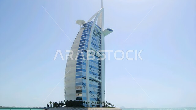 The architectural engineering of the Burj Al Arab Hotel in Dubai, areas of attraction and attraction of tourists from all over the world, the growth and urban development of towers and skyscrapers on the coast of the Arabian Gulf, famous tourist places and landmarks in the United Arab Emirates