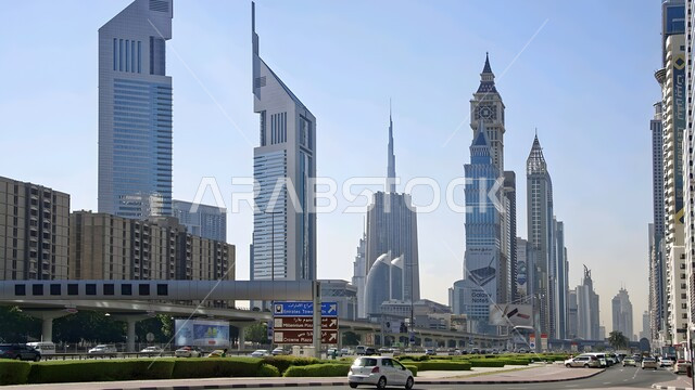 Modern architectural style of towers and skyscrapers, tourist facade in the United Arab Emirates, urban growth and development in the Arabian Gulf, attracting and attracting tourists from all over the world
