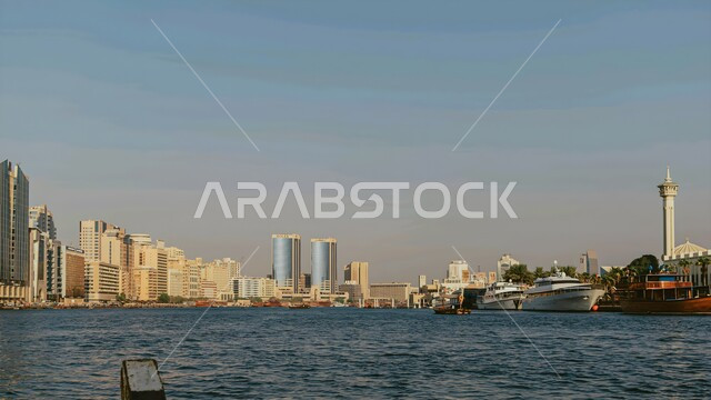 Modern architectural style of towers and skyscrapers overlooking the sea, the tourist destination in the United Arab Emirates, urban growth and development in the Arabian Gulf, attracting and attracting tourists from all over the world