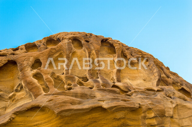 The historical beauty of Madain Saleh in Al-Ula, Saudi Arabia, the ancient Arab civilization, the natural beauty of the rock formations, the beauty of desert nature, historical archaeological landmarks, tourism in Saudi Arabia