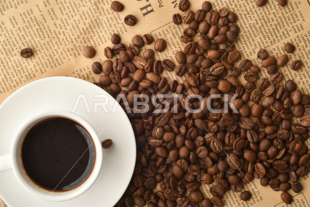 Plain black coffee cup, espresso coffee, nescafe, scattered coffee beans, hot coffee drink