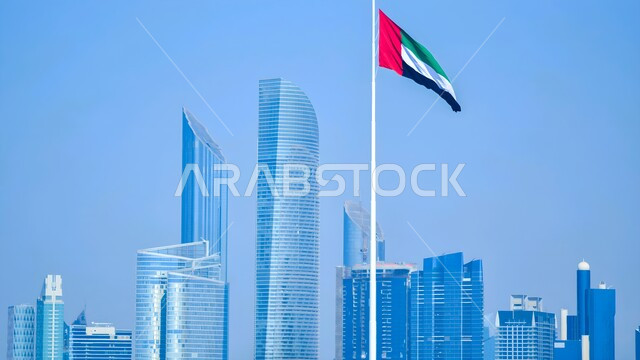 علم دولة الإمارات العربية المتحدة يرفرف في السماء، بناء مستقبل حضاري متطور في دبي، المنشآت والمباني التجارية الشاهقة، الفنون والتصاميم المعمارية الحديثة، الأبراج وناطحات السحاب في الامارات العربية المتحدة