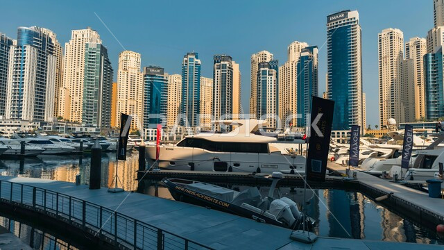 Modern architectural art of malls and skyscrapers, Emaar Properties towers, coastal tourist destination in the United Arab Emirates, shopping malls and luxury stores, Dubai Marina Mall building in the Emirate of Dubai, places of entertainment family activities
