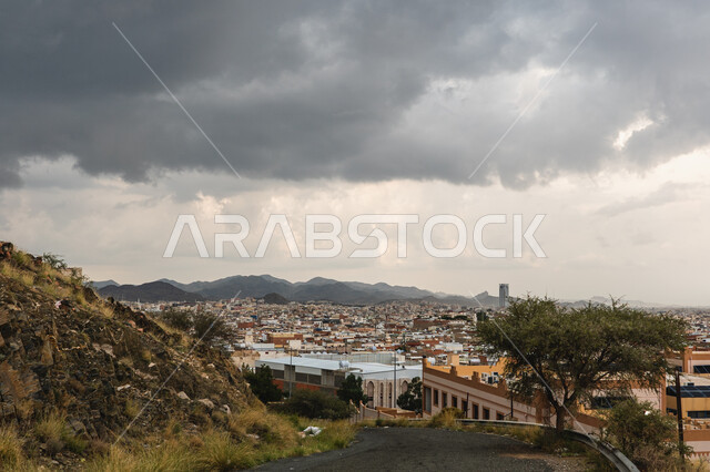 Mountainous nature in the Kingdom of Saudi Arabia, rock formations and formations, heights and peaks, winter foggy atmosphere over the mountains in the city of Taif, view of the cloudy sky, famous landmarks and tourist places