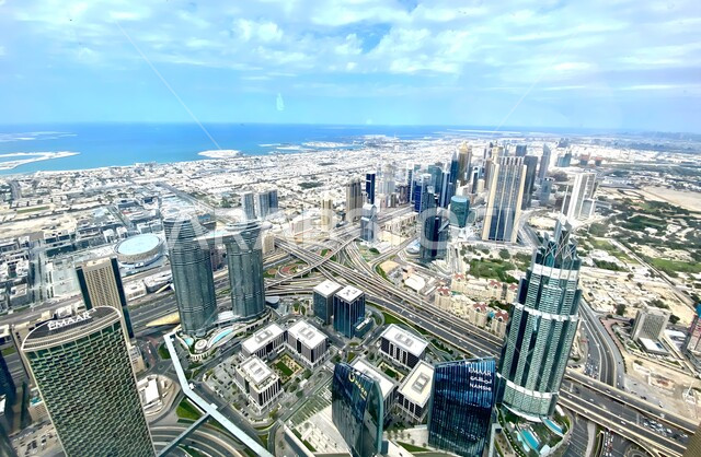 High-rise commercial buildings and facilities, modern architectural arts and designs of towers and skyscrapers, a bird's eye view of the progress and urban growth in the Emirate of Dubai, building a developed civilized future in the United Arab Emirates, improving and developing the infrastructure of tourist cities