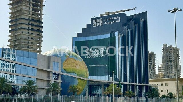 Architectural engineering art of towers and skyscrapers during the day, Saudi Press Agency in Riyadh city in the Kingdom of Saudi Arabia, urban growth and development of famous buildings in Riyadh, interest in planting palm trees and green plants