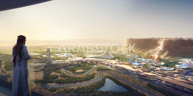 الفن الهندسي المعماري في بناء المنشآت الترفيهية العائلية، تأمل الأماكن السياحية في المملكة, صورة من الخلف لشاب عربي خليجي سعودي يرتدي الثوب التقليدي والشماغ يقف وينظر لأكبر مدينة رياضية وثقافية في القدية، النمو والتطور والتقدم العمراني والحضاري في السعودية