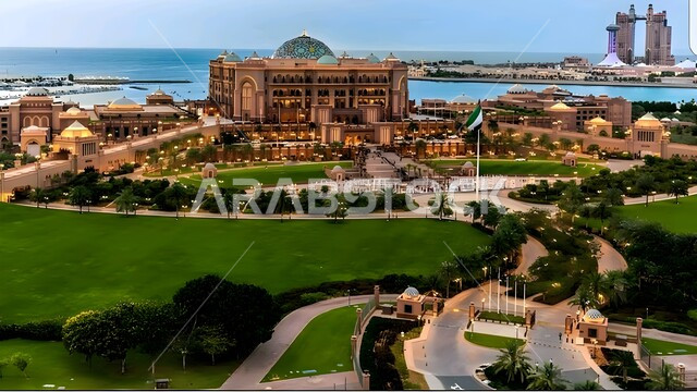 Civilizational progress and urban growth, famous landmarks and tourist places in the United Arab Emirates, advanced architectural engineering art in building resorts, hotels and skyscrapers, modern design of the Emirates Palace Mandarin Oriental overlooking the sea