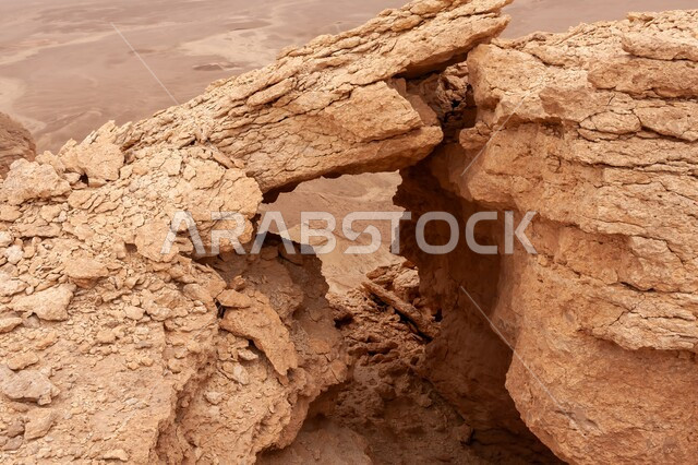 Remains of the eroded mountain ranges of the town of Al-Raghbah, natural archaeological and tourist landmarks in the Kingdom of Saudi Arabia, desert nature, terrain and mountain peaks, rock formations and formations in the desert of Riyadh, formation of sand dunes and hills, nature background