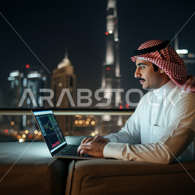 Administrative jobs and professions in Saudi Arabia, close-up side view of a Saudi Arabian Gulf man wearing a traditional keffiyeh and thobe following the stock market through a laptop, the rise and fall of the financial stock market, the use of modern advanced devices and technologies, financial and economic investment