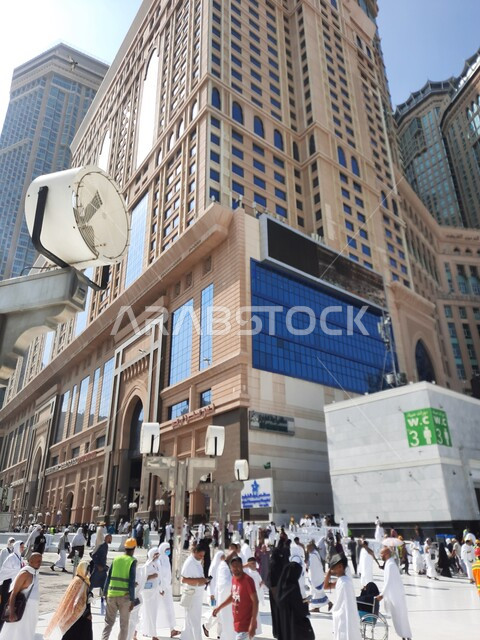 The concept of worship and drawing closer to God, the outer courtyard of the Grand Mosque during the day, the outer courtyards of the Grand Mosque in Mecca, the arrival of Muslims from all over the world to perform the Hajj and Umrah rituals, the holy Islamic religious places and landmarks in the Kingdom of Saudi Arabia