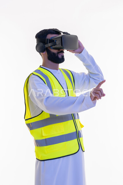 Interacting with virtual engineering, raising index finger to touch holographic elements, portrait of an Arab Gulf Emirati engineer wearing a kandura, work jacket and virtual reality glasses, future vision 2030, integrating technology with engineering fields, growth and development of the engineering field, white background