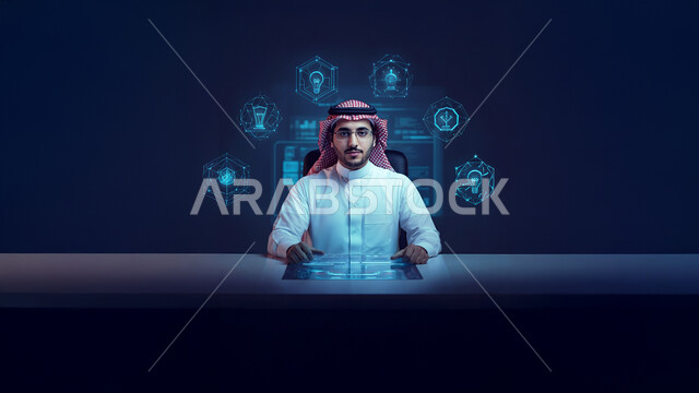 مفهوم إدارة الأعمال بالاعتماد على التكنولوجيا الحديثة، رجل عربي خليجي سعودي يرتدي الثوب التقليدي والشماغ ويضع النظارة الطبية يجلس وراء طاولة المكتب وينظر للكاميرا بإيماءات الثقة بالنفس، أيقونات هولوجرامية مضيئة ثلاثية الأبعاد ترمز إلى الاستثمار وتطوير المشاريع