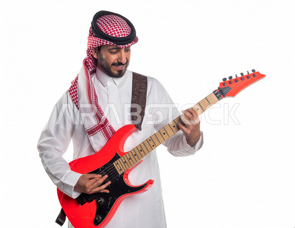 A portrait of a Saudi Arabian Gulf man playing the electric guitar, musical instruments, artistic talents, and musical arts.