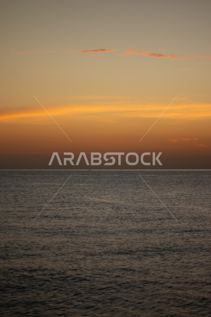 Sunset reflection on the sea water, landscapes in Saudi Arabia, places and areas of attraction and attraction of tourists, calm atmosphere on the beach