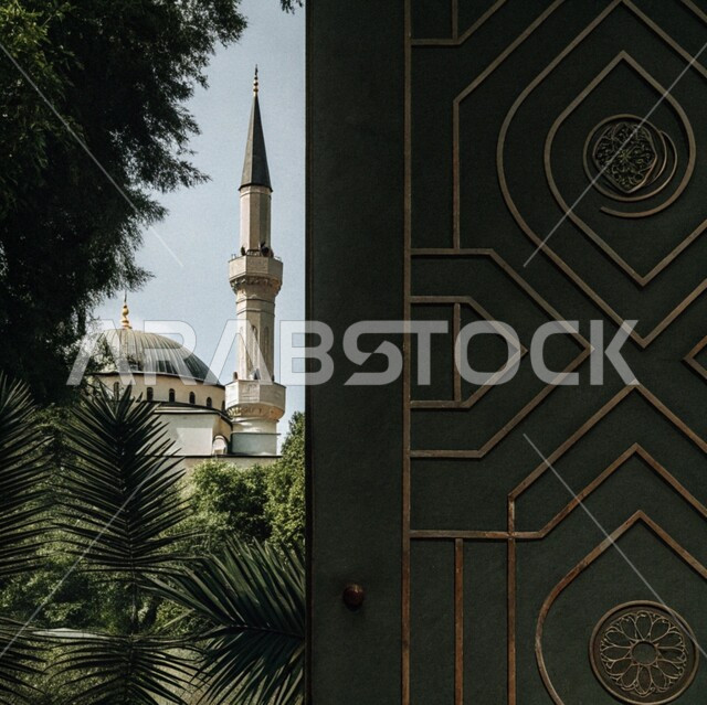 Worship and getting closer to God in the holy month of Ramadan, taking care of planting palm trees, elegant exterior designs and decorations for mosques in the Kingdom of Saudi Arabia, Islamic architectural art, engravings and decorations on the exterior walls, spiritual Ramadan atmosphere