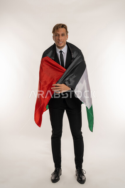 UAE National Day December 2, Celebrating National Holidays of Peoples, Commemorating the Independence of the Country, Portrait of a Foreign Man in a Suit Holding UAE Flag on His Shoulder, Standing Straight and Looking at the Camera with Gestures of Pride and Honor, Full Body Photo, White Background