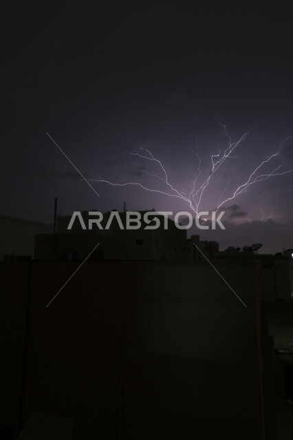 Weather conditions, disasters and natural phenomena, thunder and lightning in the sky of Jeddah, a thunderstorm hits Al-Safa district at night, winter weather in the Kingdom of Saudi Arabia, nature background