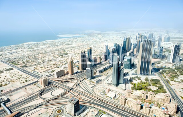 Modern architectural arts and designs of towers and skyscrapers, infrastructure development of tourist cities, high-rise commercial facilities and buildings, a bird's eye view of the progress and urban growth in the Emirate of Dubai, architectural engineering art in building the Index Tower in the United Arab Emirates