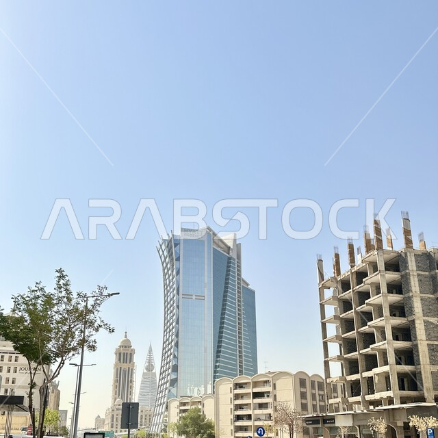 Distinctive architectural engineering art in the design of the Hyatt Regency Hotel in Riyadh, urban growth and development in the Kingdom of Saudi Arabia, luxury hotels and tourist resorts, the concept of tourism in the Gulf countries, towering towers and skyscrapers, clear blue sky background