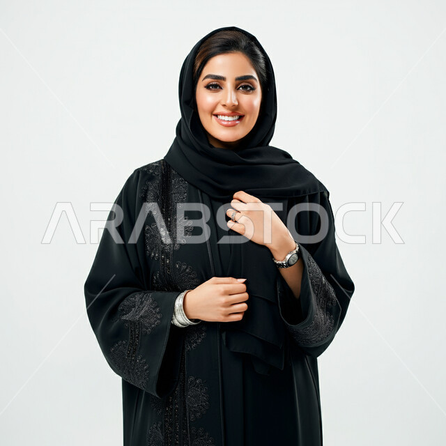 تعابير السرور والسعادة، التقاط صور شخصية للوثائق الرسمية، مفهوم الأناقة والأنوثة, بورتريه لامرأة عربية خليجية سعودية ترتدي الحجاب والعباءة تنظر إلى الكاميرا بايماءات الثقة بالنفس, الاهتمام بالمظهر الخارجي، خلفية بيضاء