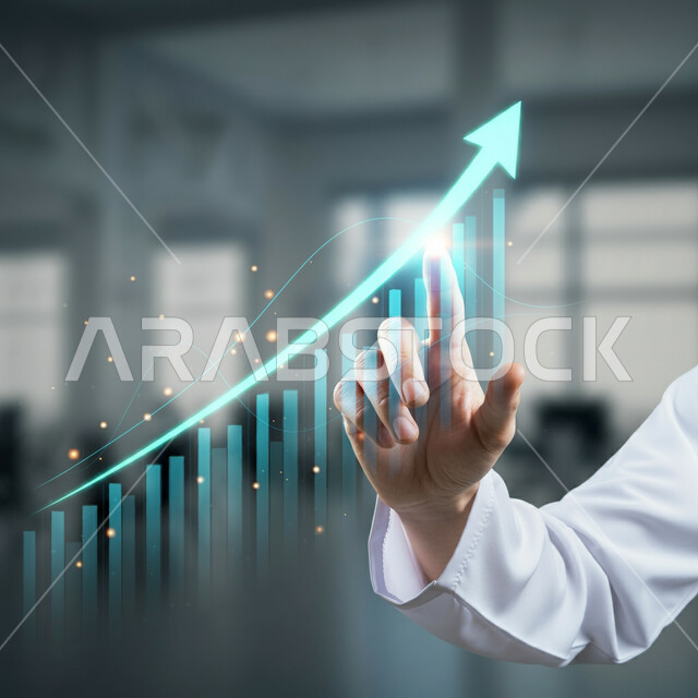 تداول العملة الرقمية، إنجاز وتحقيق أهداف الشركة, صورة مقربة ليد رجل أعمال عربي خليجي سعودي يشير إلى مخطط هولوجرامي للرسم البياني للنمو الاقتصادي، دمج التكنولوجيا المتطورة مع العمل، مراقبة ارتفاع وانخفاض الأسهم في سوق البورصة