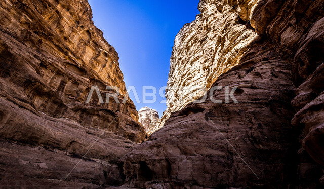 Rock formations and formations in the desert of Al-Ula Governorate, mountain peaks and heights in the middle of the desert environment, ancient historical monuments, distinctive natural landscapes, famous tourist places in the Kingdom of Saudi Arabia