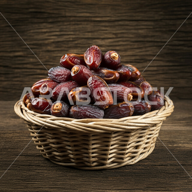 Delicious healthy dates, healthy and beneficial food, highly nutritious meal, local national agricultural products and crops, a basket full of fresh dates, delicious Ramadan hospitality