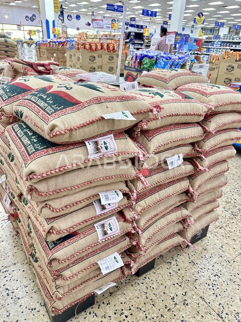 Piles of rice bags in a Saudi Arabia supermarket, consumer supplies ...