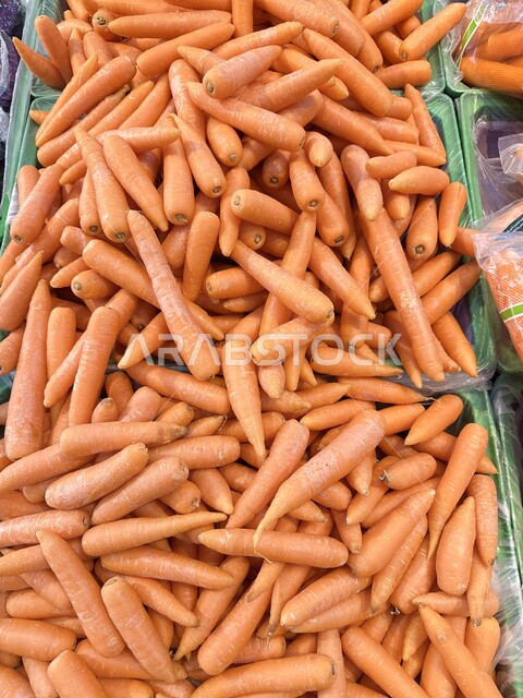 Interest in local agriculture and self-sufficiency, national agricultural products and crops, harvest season of agricultural crops on farms, healthy and useful foods, Riyadh fruit and vegetable market, close-up of carrots in the supermarket