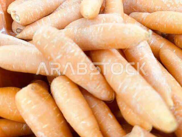 Interest in local agriculture and self-sufficiency, national agricultural products and crops, harvest season of agricultural crops on farms, healthy and useful foods, Riyadh fruit and vegetable market, close-up of carrots in the supermarket