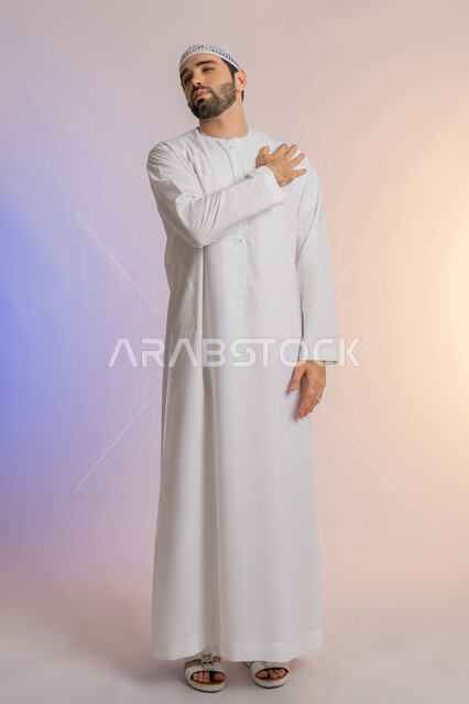 Muscle and joint inflammation, feeling tired and exhausted, gestures of pain in the shoulders, portrait from the back of an Arab Gulf Emirati man wearing a kandura and a white hat, putting his hand on his shoulder with expressions of pain, need to develop a treatment plan, requesting help to go to the hospital, colored background