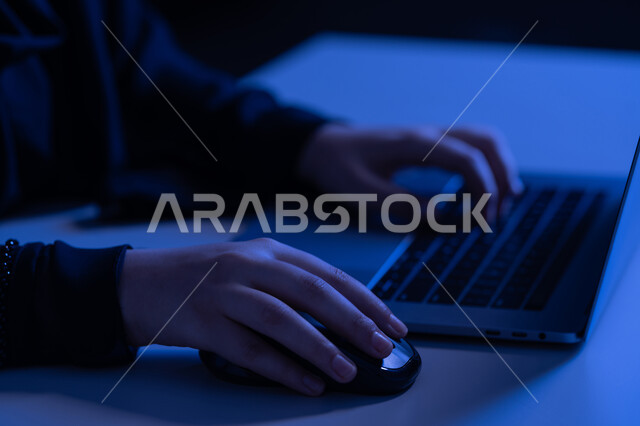 Text content creation, data entry concept, close-up of hands of an Arab Gulf Emirati woman using a laptop, young Saudi woman typing on a keyboard, integrating modern technology into practical life, office administrative jobs and professions