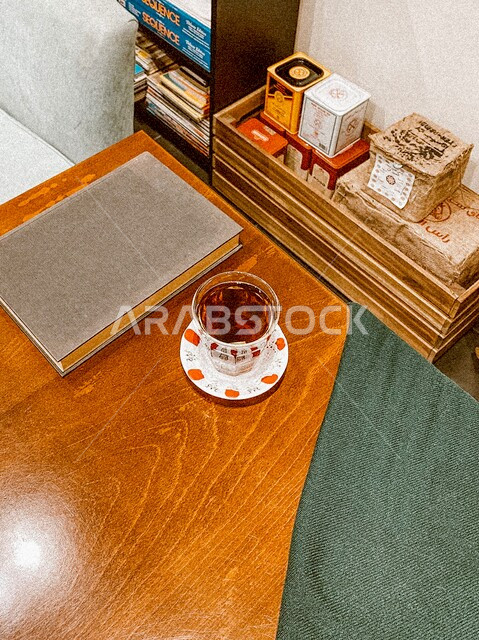 A picture from the top of a table with a cup of delicious hot tea, a wonderful and beautiful ambiance in the coffee shop in Saudi Arabia