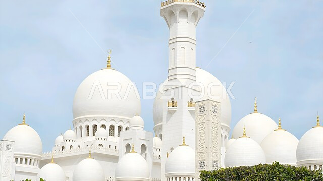 Calling Muslims to perform acts of worship and duties, places of worship and drawing closer to God Almighty, sacred Islamic landmarks, close-up of the domes in the Sheikh Zayed Grand Mosque built in the modern Islamic style in Abu Dhabi, architectural engineering art of building mosques in the United Arab Emirates