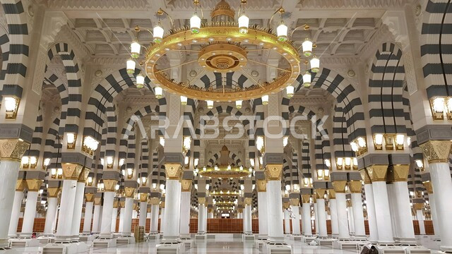 Architectural engineering art of building mosques, distinctive designs of columns and arches of the Prophet’s Mosque in Medina, sacred Islamic religious landmarks in the Kingdom of Saudi Arabia, the concept of worship and drawing closer to God Almighty